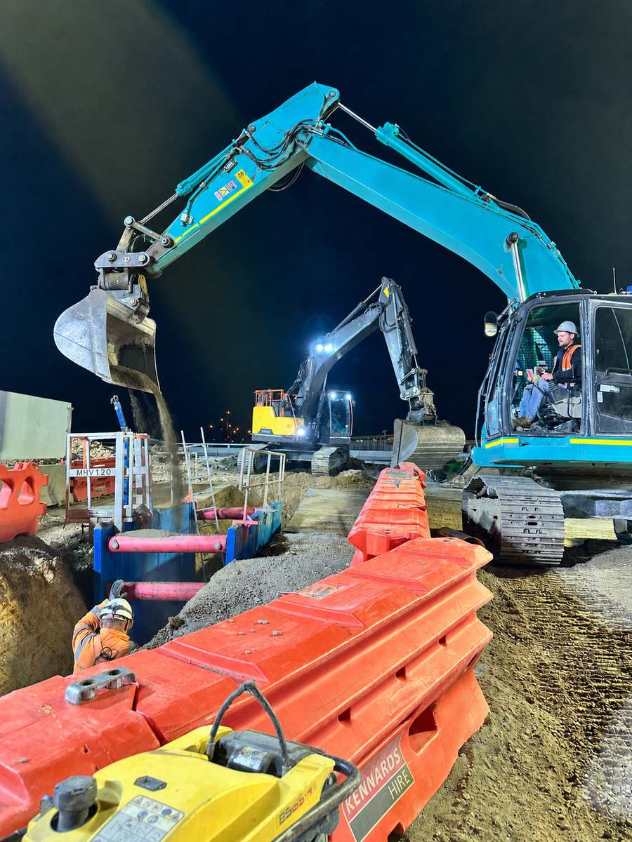 Night works with excavators over trench shields